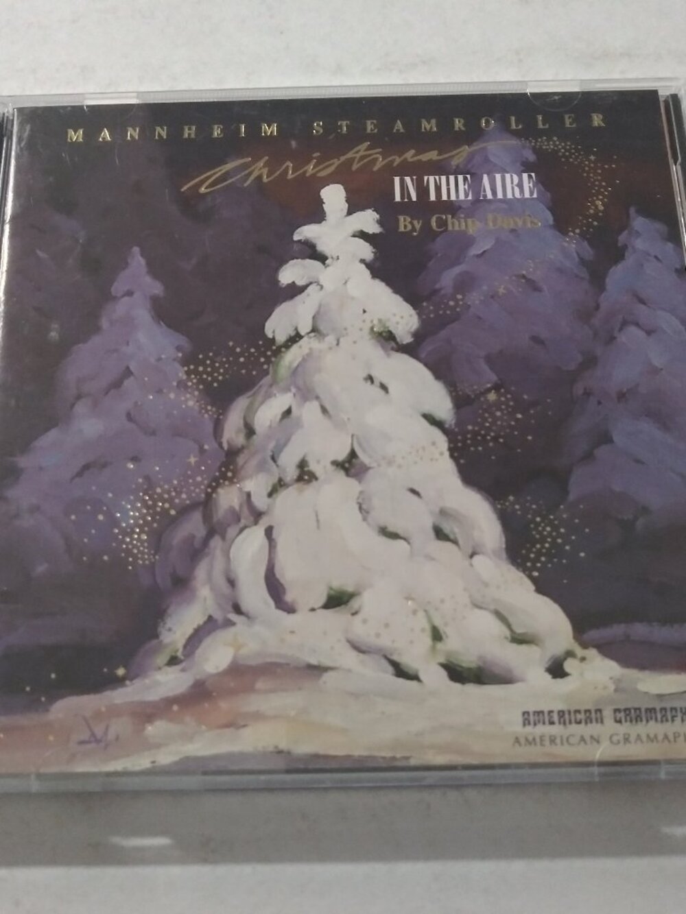 Mannheim Steamroller By Chip Davis – Christmas In The Aire NM AGR CD 1995 INSERT